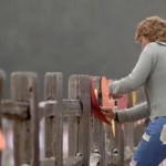 Fan From Germany Putting Signs on Fence At Neverland
