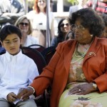 Katherine Jackson holds the hand of her grandson during a private ceremony at the Children's Hospital in Los Angeles