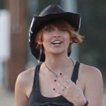 Cowgirl Paris Jackson offers pizza to Paparazzi street side of her mom, Debbie Rowe's Ranch in Palmdale
