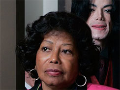 In this May 20, 2005 file photo, Michael Jackson, background, and his mother Katherine Jackson pass through a security check point on the way to his child molestation trial at the Santa Barbara County Courthouse in Santa Maria, Calif.